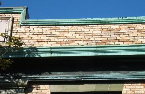 This image provides a view of the brick parapet above the cornice, 2006.; City of Saint John