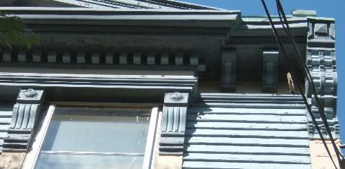 This image shows the wood cornice supported by brackets, 2006.; City of Saint John