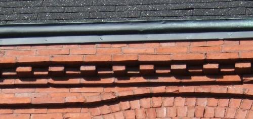 This image provides a view of the cornice ornamented by brick dentils, 2005.; City of Saint John