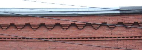 This image provides a view of the cornice ornamented by brick corbel bands, 2005.; City of Saint John