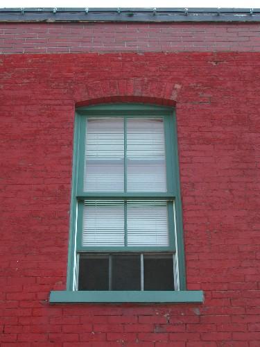 This photograph shows one of the segmented arch windows, 2005.; City of Saint John
