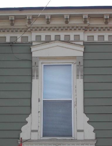 This image provides a view of the cornice supported by decorative brackets, 2005. ; City of Saint John