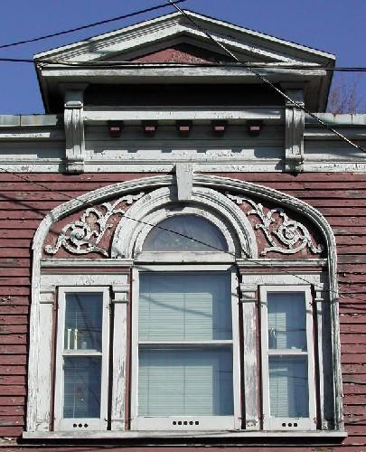 This image provides a view of the elaborate pediment, the cornice and the central Palladian window, 2005.; City of Saint John