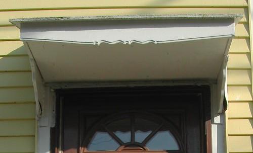 This image provides a view of the entablature over the entrance, 2005.; City of Saint John