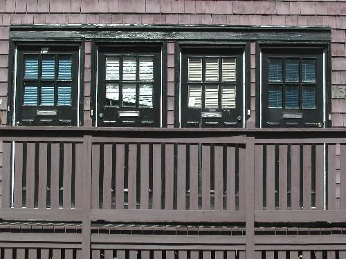 This photograph shows the four symmetrical entrances in the centre of the front façade, 2005.; City of Saint John