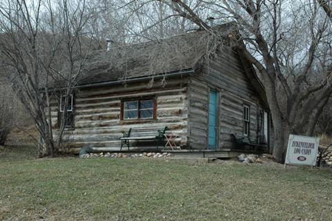 View of the Eckenfelder Log Cabin at the St. Anne Ranch Provincial Historic Resource site, Trochu looking northwest (April 2006); Alberta Culture and Community Spirit, Historic Resources Management, 2006