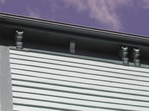 This photograph shows the cornice with brackets, 2005.; City of Saint John