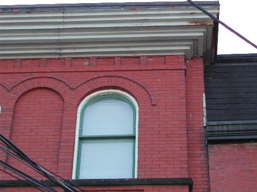 This photograph shows the Roman arch windows and the cornice, 2005.; City of Saint John
