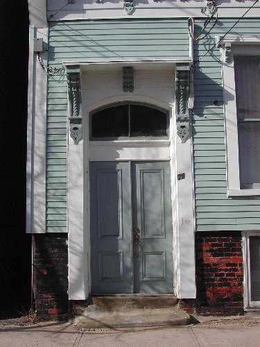 This photograph shows the entrance with bracketed entablature, 2005.; City of Saint John