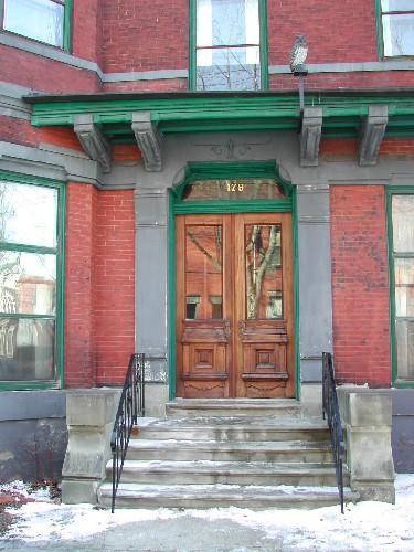 This photograph shows the entrance with large sandstone pilasters, 2005.; City of Saint John