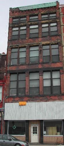 This photograph shows the contextual view of the Water Street façade, 2005.; City of Saint John