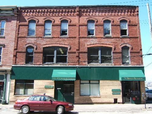 This photograph shows the contextual view of the building, 2005.; City of Saint John