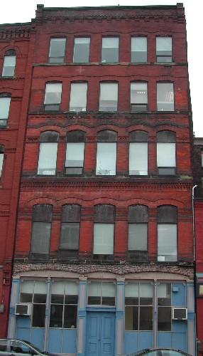 This photograph shows the Water Street façade, 2005.; City of Saint John