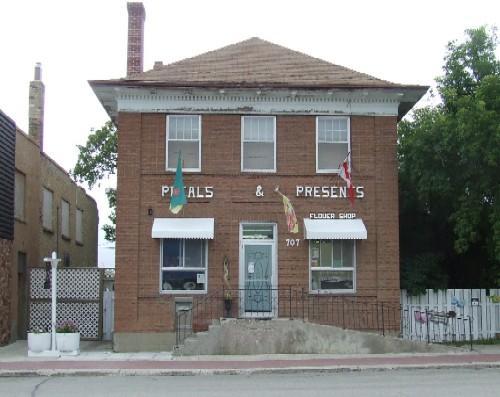 View of front of Old Bank of Montreal featuring the symetrical brick façade, 2007.; J. Kasperski, 2007.