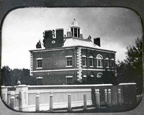 View of the front of the house including original fence and garden; Archives of Ontario