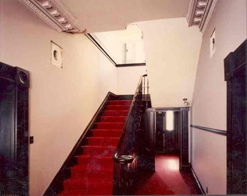 View of the main floor hallway and stairs; OHT