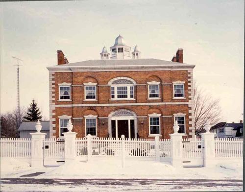 View of the front of McMartin House including fence; OHT
