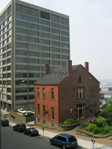 This image shows the two-and-a-half storey building located at 9 Chipman Hill.; Province of New Brunswick