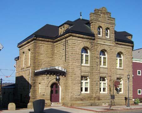 This image shows an oblique view of the front and side elevations of the building, 2005.; City of Miramichi