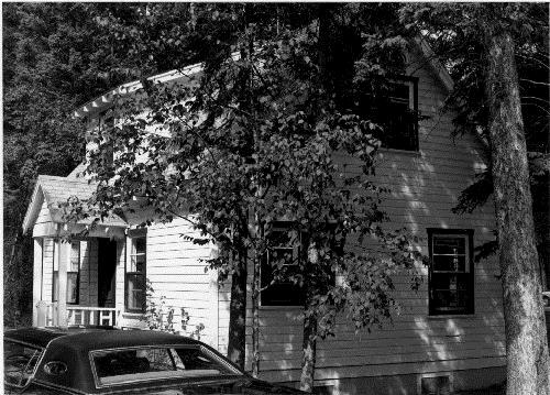 Corner view of the Doctor's Residence and Clinic showing the rear and side façades, 1984.; Parks Canada Agency / Agence Parcs Canada, S.Siepman, 1984.