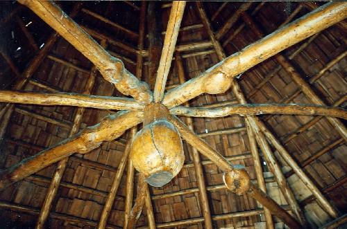 Interior view of the Devonian Pavilion showing exposed roof framing and the acorn ornament of the center post, 1997.; Agence Parcs Canada / Parks Canada Agency, 1997.
