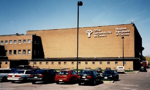 Front elevation of the National Film Board, showing the exterior cladding of buff-coloured brick, 1998.; Public Works and Government Services Canada / Travaux publics et Services gouvernementaux Canada, 1998.