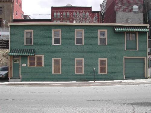 This photograph shows the front façade of the building, 2005.; City of Saint John