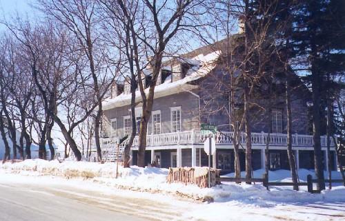 Corner view of the Louis Bertrand House, showing its Neoclassical stylistic elements and "maison québecoise" qualities, 1999.; Parks Canada Agency / Agence Parcs Canada, 1999.
