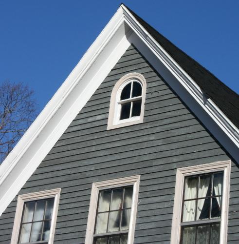 Showing gable detail with round arch window; Province of PEI, 2007