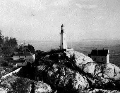 Historical photograph of the Light Tower at Point Atkinson, showing its compatibility with its wilderness seascape setting, 1925.; Parks Canada Agency / Agence Parcs Canada, 1925