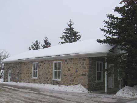 View of the south and west elevations depicting the rubble-stone cladding, 2007.; Lindsay Benjamin, 2007.