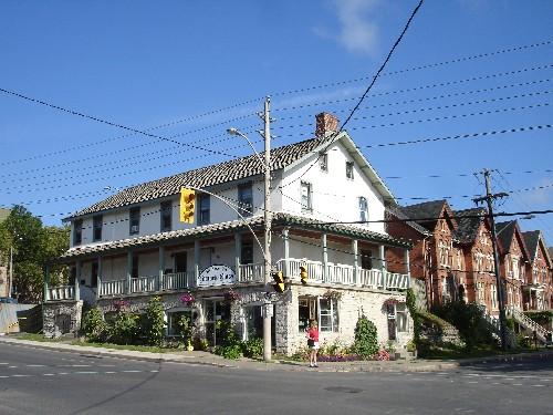 157-161 Queen St. E. in context on the corner of Queen and Montreal Streets, Kingston ON; RHI 2006