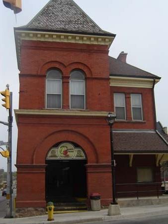 Of note are the patterned asbestos roof and the arched transom paned windows on the tower.; Kendra Green, 2007.