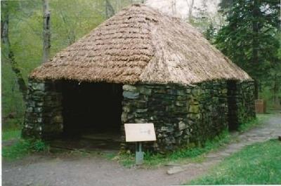 Front elevation of the Lone Shieling, showing its simple, low massing composed of a rectangular structure with low, heavy walls and a steeply pitched hipped roof, 1993.; Parks Canada Agency / Agence Parcs Canada, 1993.