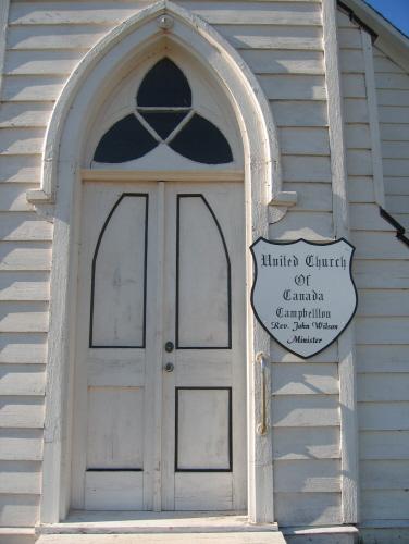 Showing detail of door with trefoil window; Province of PEI, 2007