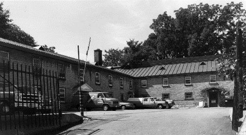 General view of the St. Louis Barracks, showing the metal covered gable roofs, 1987.; Department of National Defence / Ministère de la Défense nationale, 1987.