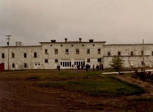 Front elevation of Building 29, showing the regular placement of windows and doors, all with simple detailing.; Parks Canada Agency / Agence Parcs Canada.