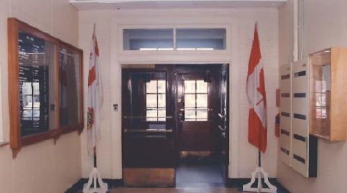 Interior view of Building S-17, showing the wooden doors of the main entrance.; Department of National Defence / Ministère de la Défense nationale.