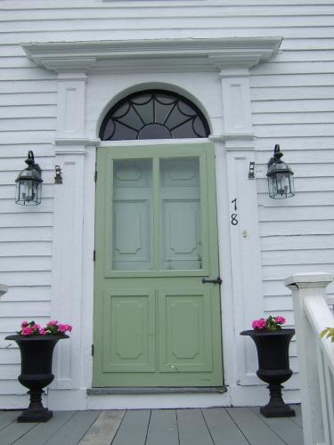 This photograph shows the entrance with fanlight and large entablature, 2007.; Town of St. Andrews