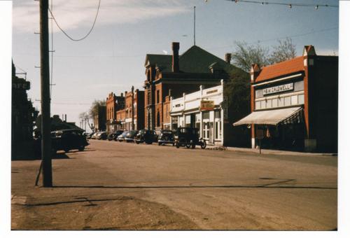 Archival view showing the early quality and condition of the west side of the Historic Downtown Carberry heritage district, Carberry, ca. 1944.; Historic Resources Branch, Manitoba Culture, Heritage, Tourism and Sport, 2008