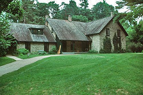 Front elevation of the House, showing the shed-roofed dormer and steeply pitched gable roof, 2003.; Parks Canada Agency / Agence Parcs Canada, B. Morin, 2003.