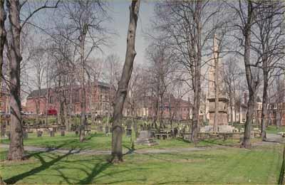 General view of the Old Burying Ground, showing the haphazard placement of graves and the forms of head and foot stones as well as box tombs, 1993.; Agence Parcs Canada / Parks Canada Agency, 1993.