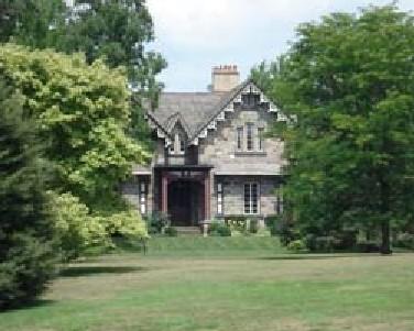 Featured is the double-gable stone façade with decorative bargeboard.; Kendra Green, 2007.