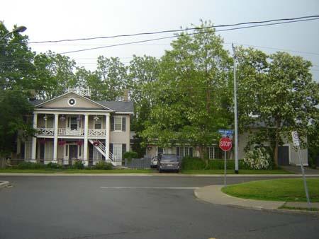 Of note are the pedimented portico and plaster and stucco construction.; Kayla Jonas, 2007.
