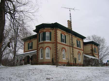 Featured are the shallow-arched first-storey and deep-arched second-storey windows.; County of Brant, Community and Development Services, 2007.